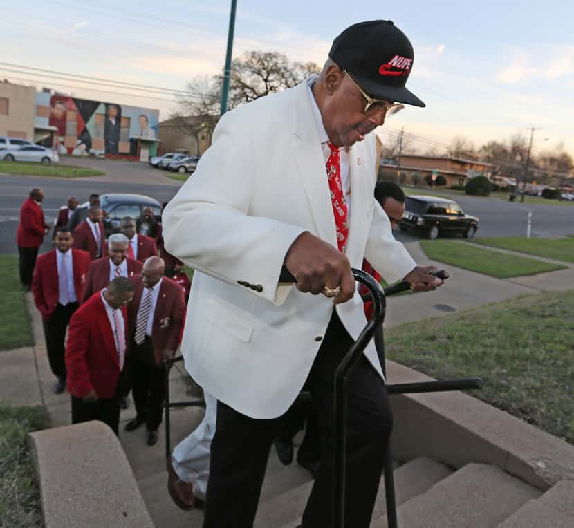 Kappa Alpha Psi 50-year member Stephen Washington climbs the stairs to get to the chapter's...