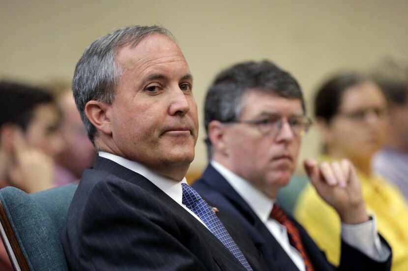 FILE - In this July 29, 2015 file photo, Texas Attorney General Ken Paxton looks during a...