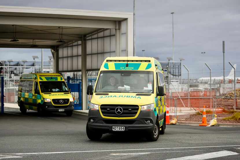 Ambulances leave Auckland International Airport in New Zealand as they shuttle injured...