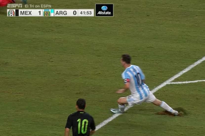 Argentina's Lionel Messi tore a large section of field while turning during a 2-2 draw with...