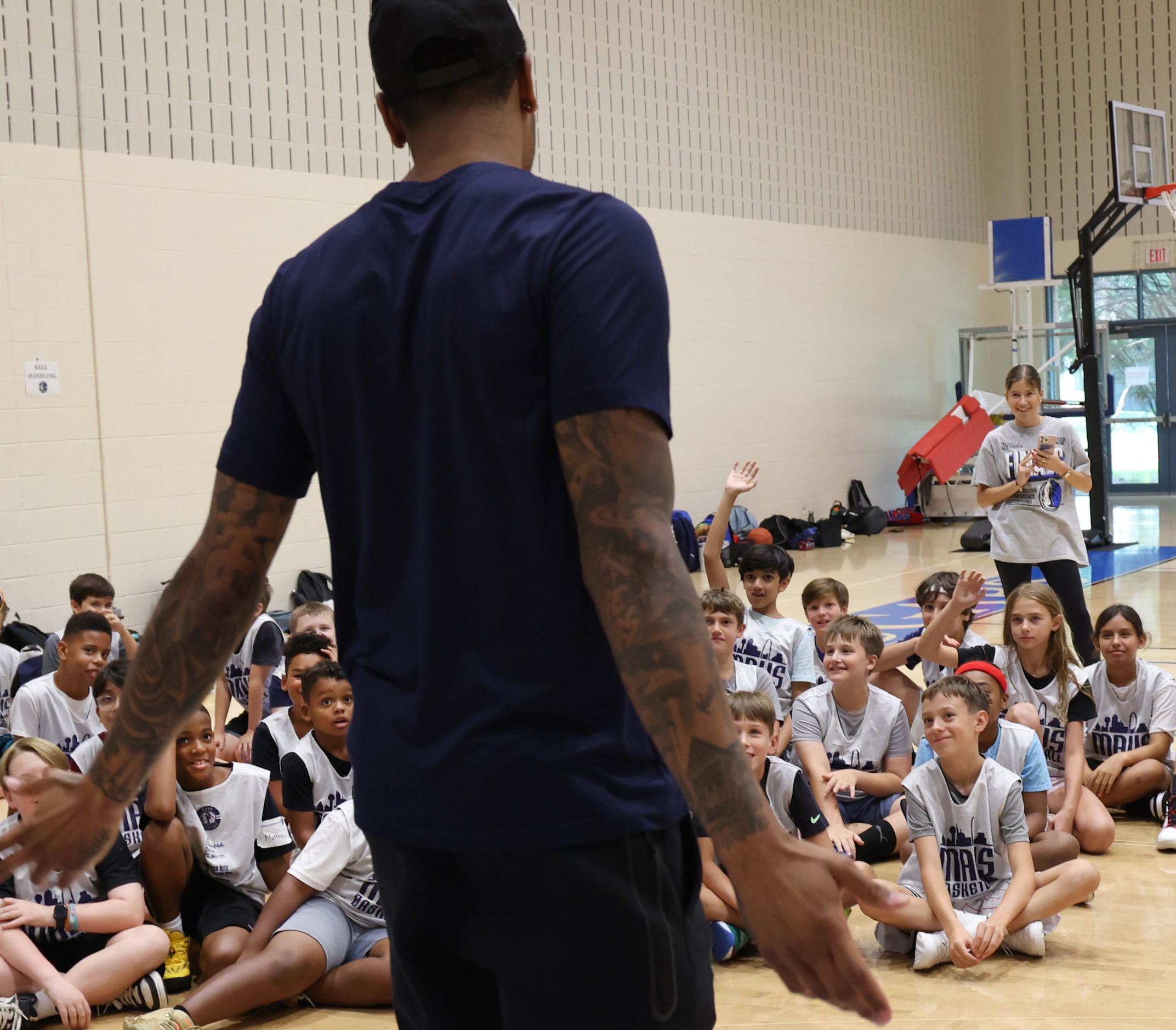 Dallas Mavericks forward and center PJ Washington shares a light moment with Hoop Camp...