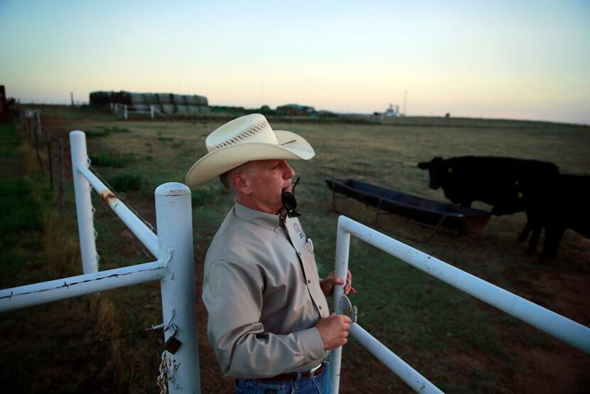 Dean Hawkins, West Texas A&M Agriculture and Natural Sciences acting dean, closes a gate on...