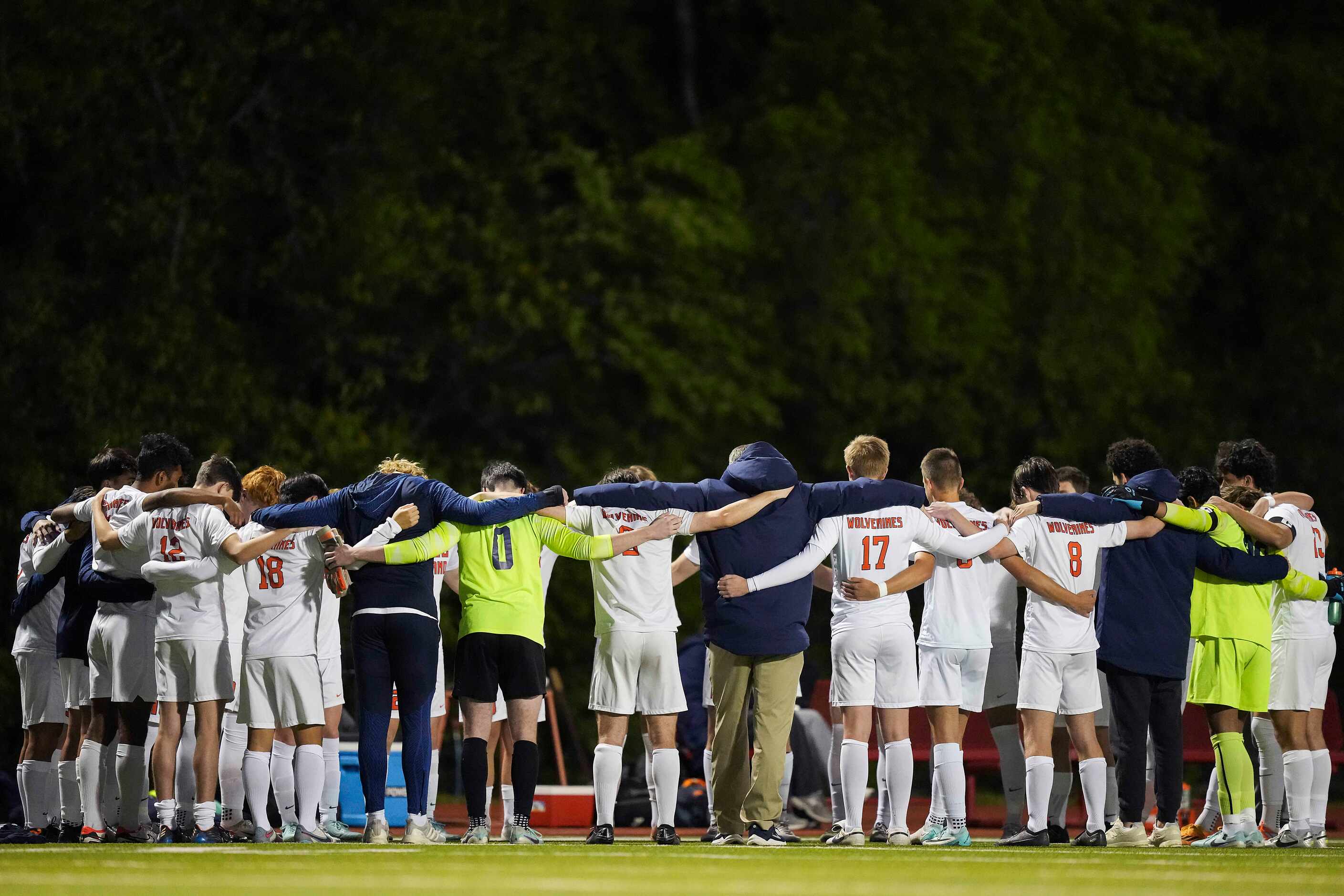 Frisco Wakeland players huddle with coaches before a Class 5A Region II high school soccer...