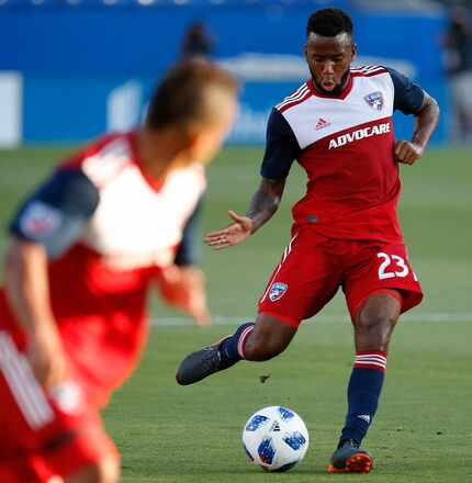 FC Dallas midfielder Kellyn Acosta (23) passes the ball against the Montreal Impact during...