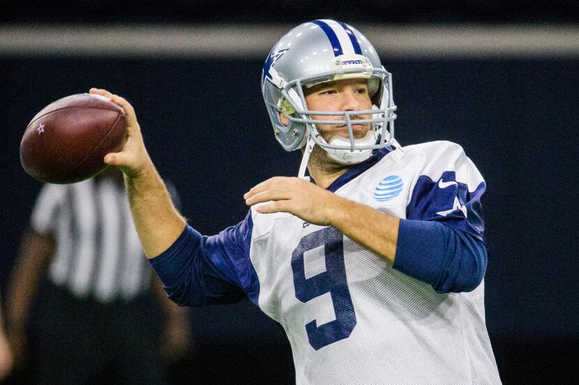 Dallas Cowboys quarterback Tony Romo (9) throws a pass during their practice on Friday,...