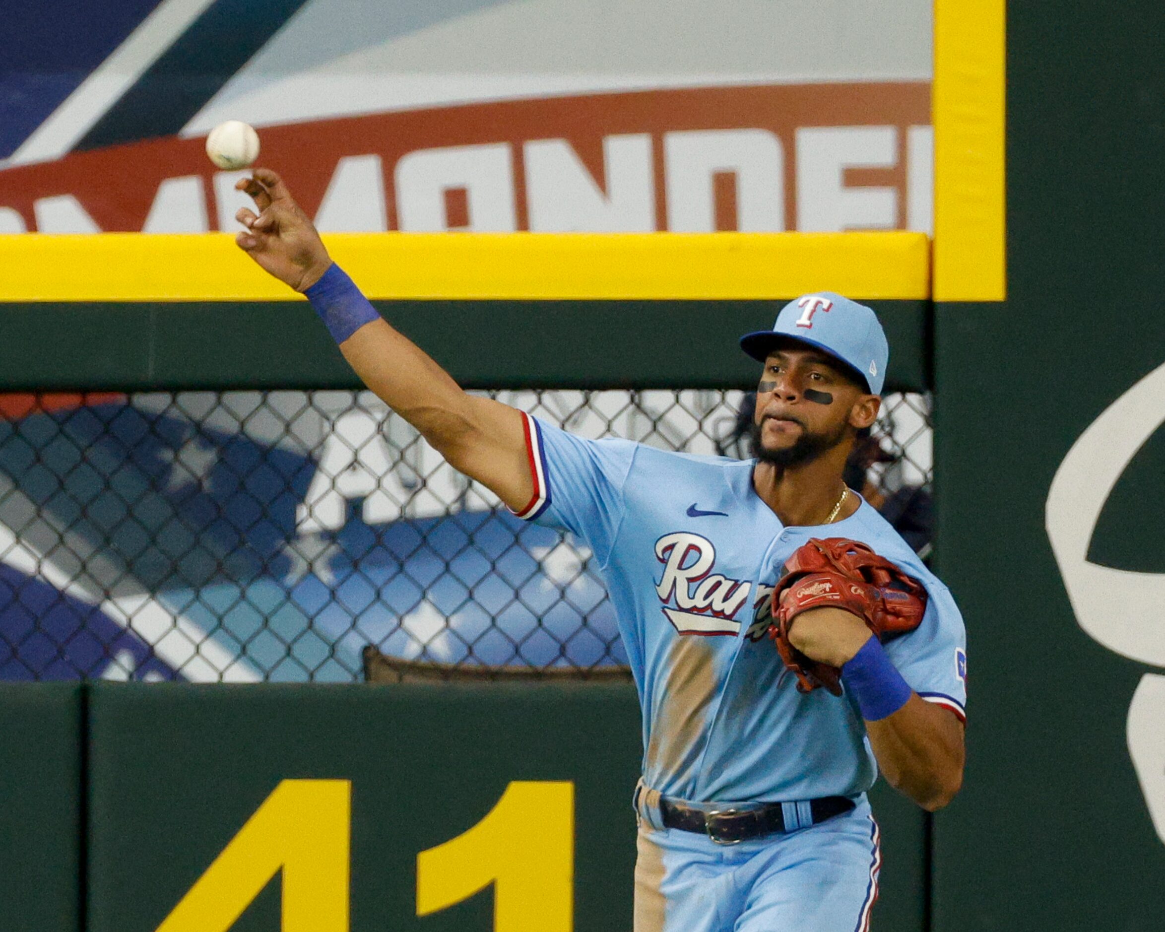 Texas Rangers center fielder Leody Taveras (3) throws towards the infield after a hit during...