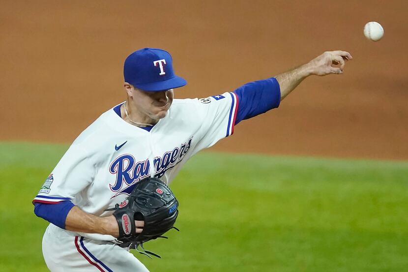 Texas Rangers relief pitcher John King delivers during the fourth inning against the Los...