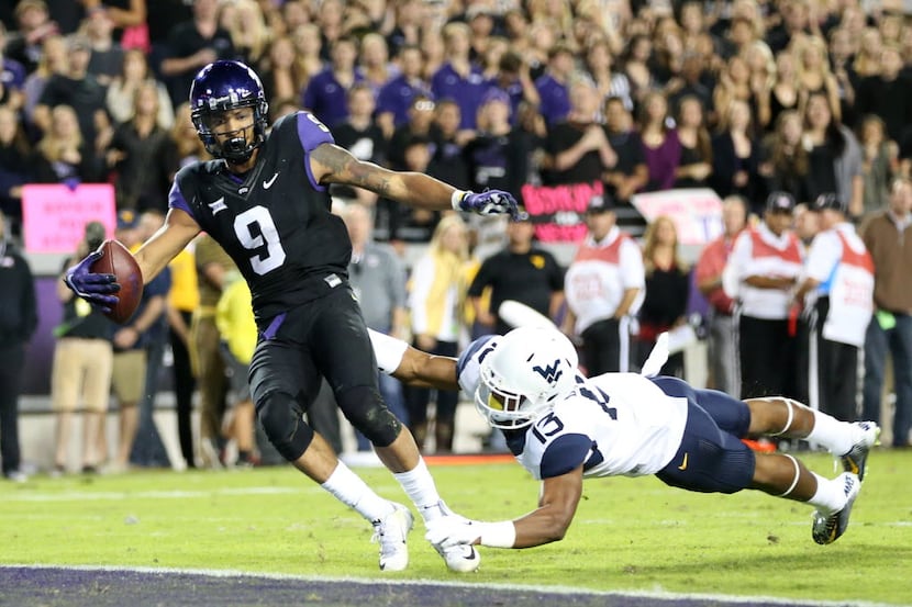 TCU Horned Frogs wide receiver Josh Doctson (9) scores a touchdown as West Virginia...