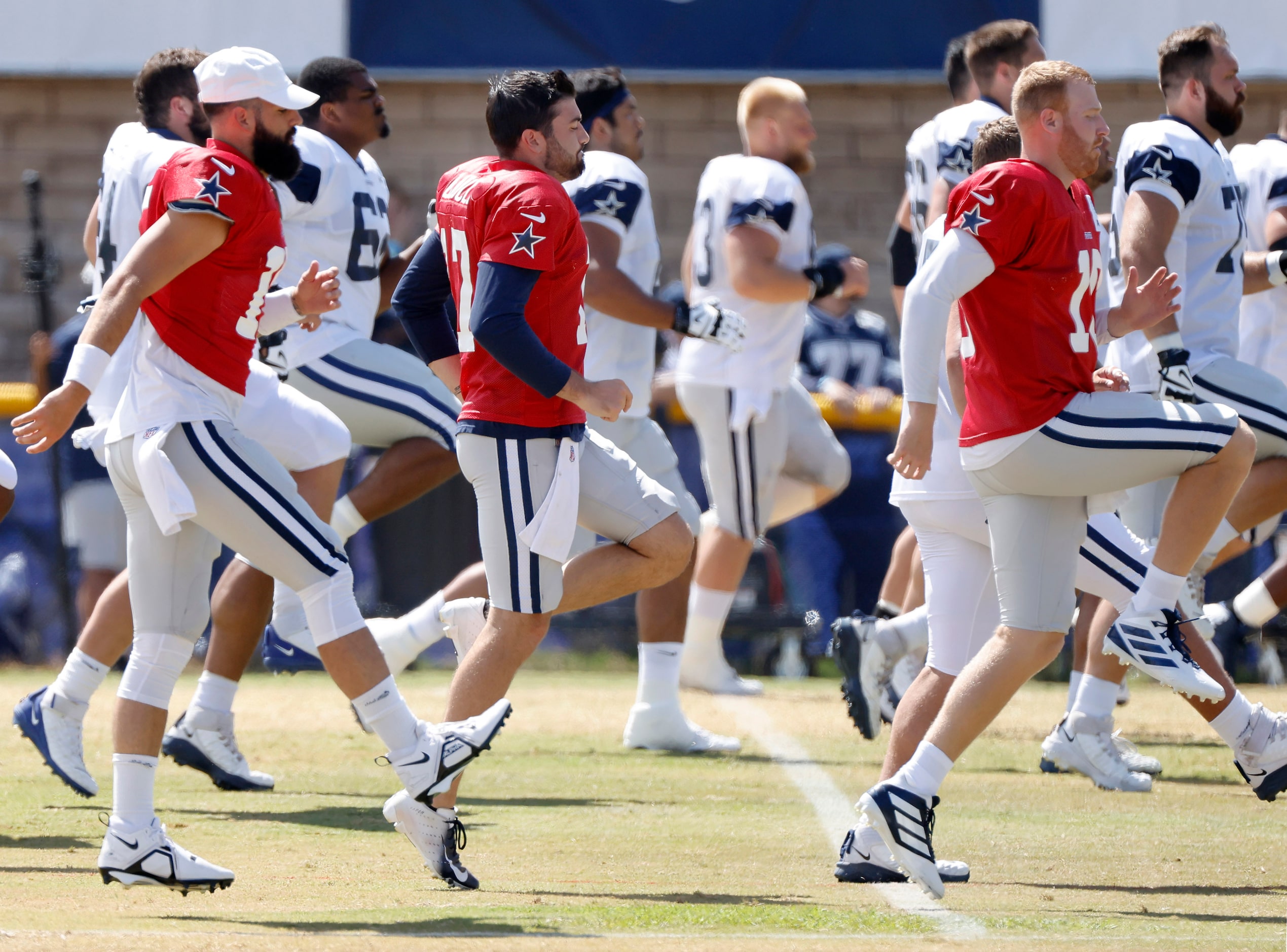 Dallas Cowboys backup quarterbacks (from right) Cooper Rush (10), Ben DiNucci (17) and Will...