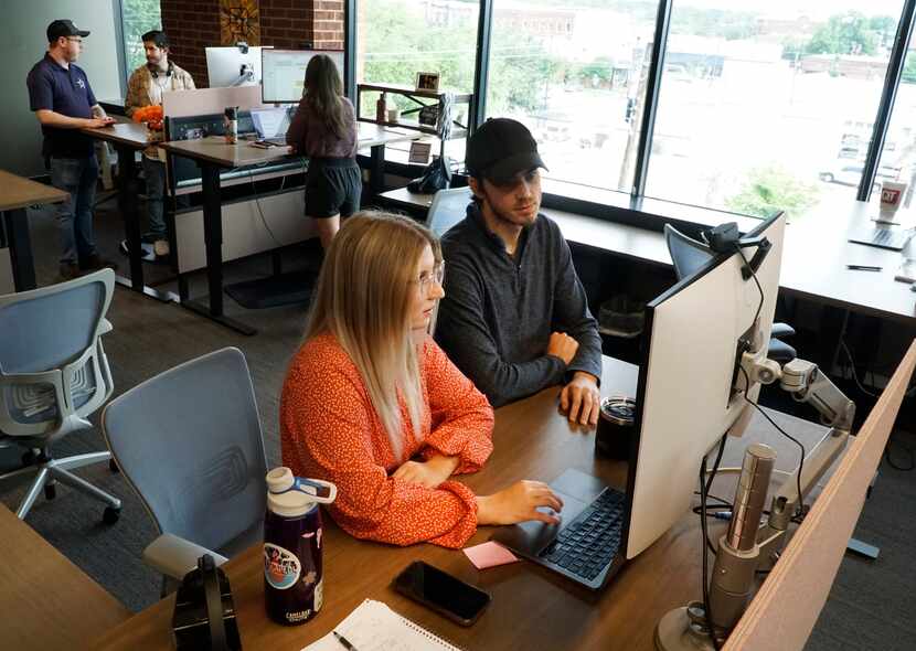 Review Wave support team members Sarah Brock and Zachary Luhring work on a project in the...