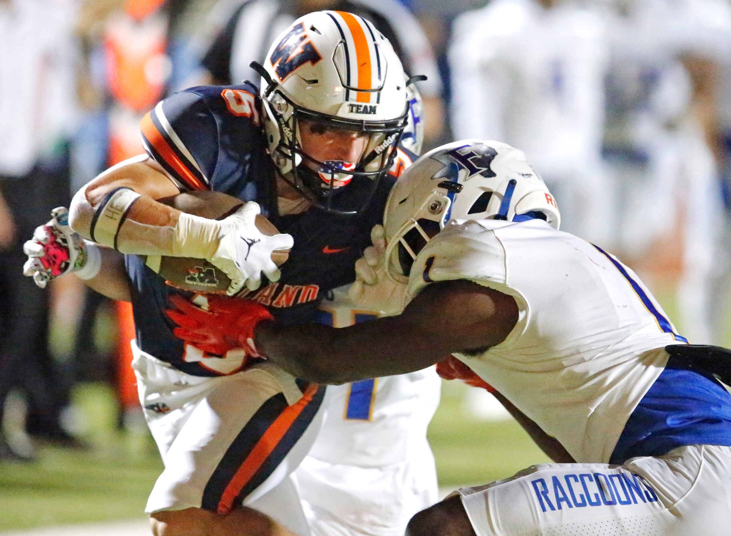 Wakeland High School wide receiver Ashdyn Kahouch (5) is tackled between Frisco High School...