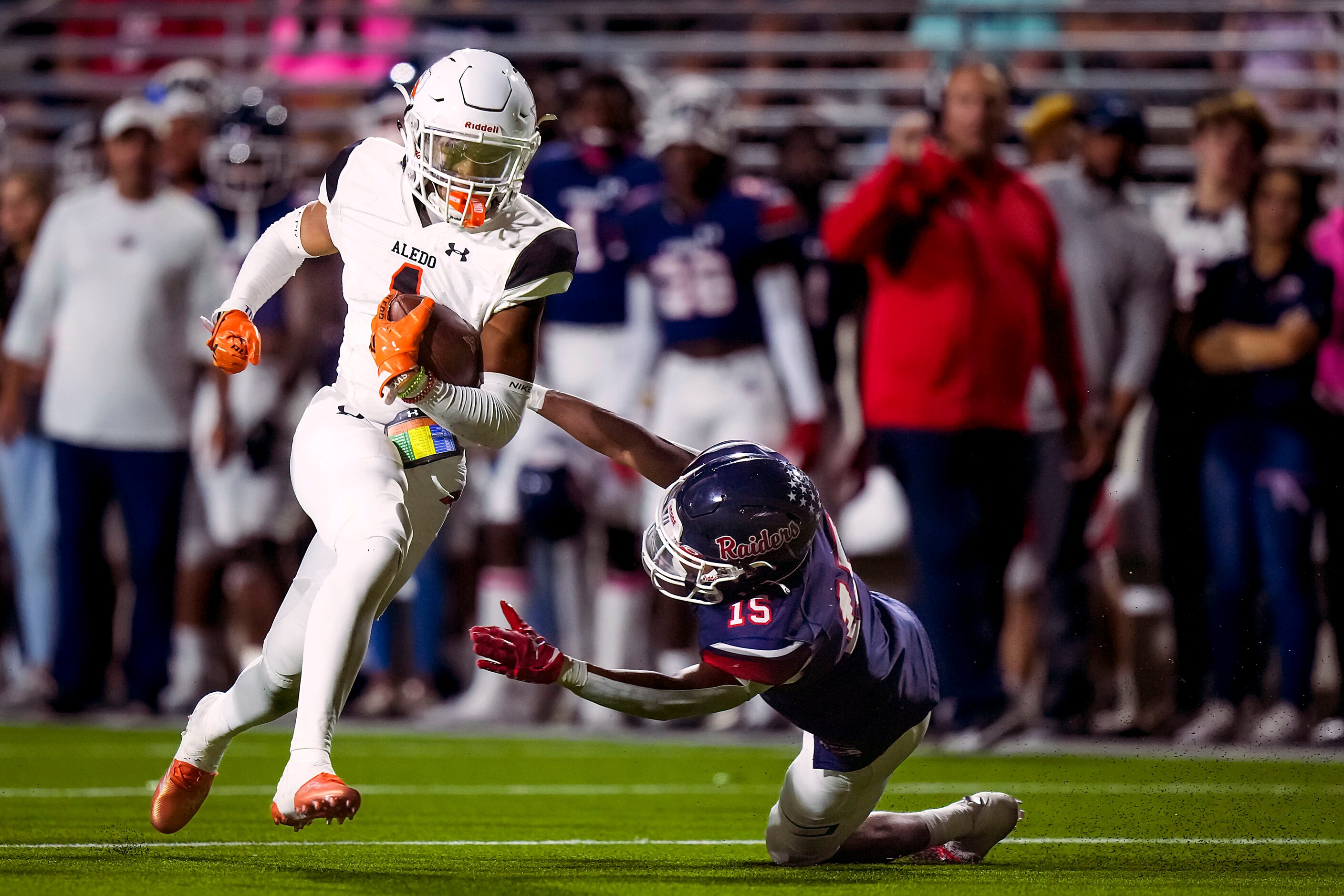 Aledo’s  Hawk Patrick-Daniels (1) gets past Denton Ryan defensive back Trae Williams (15)...