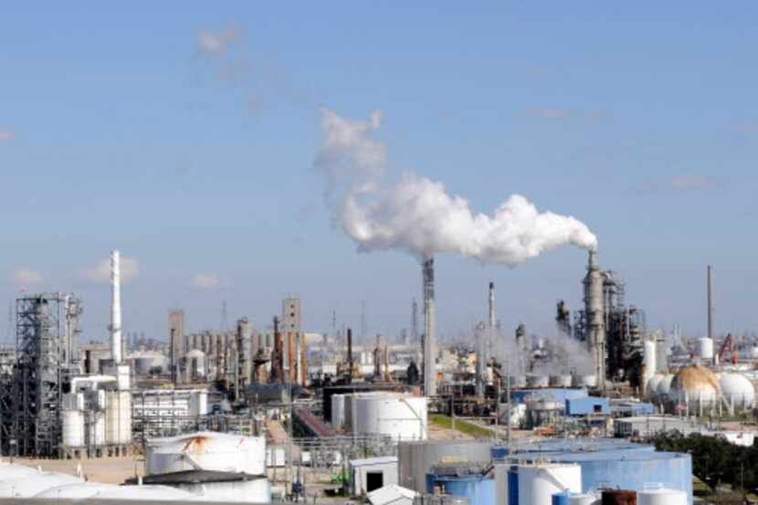 
A sea of stacks, pipes and storage tanks are amassed along the Houston ship channel in this...