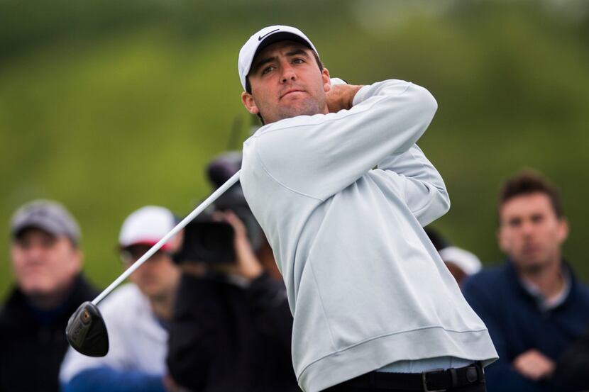 Scottie Scheffler tees off at hole 14 during round 2 of the AT&T Byron Nelson golf...