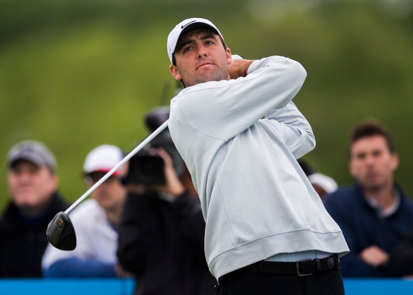 Scottie Scheffler tees off at hole 14 during round 2 of the AT&T Byron Nelson golf...