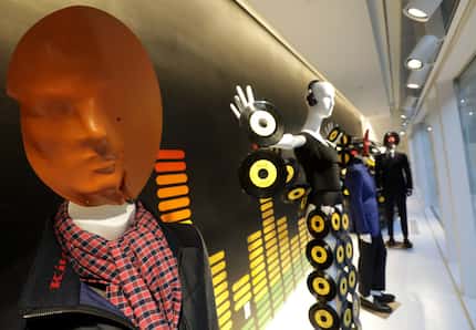 Many of the male mannequins have vinyl record sculptures for faces.