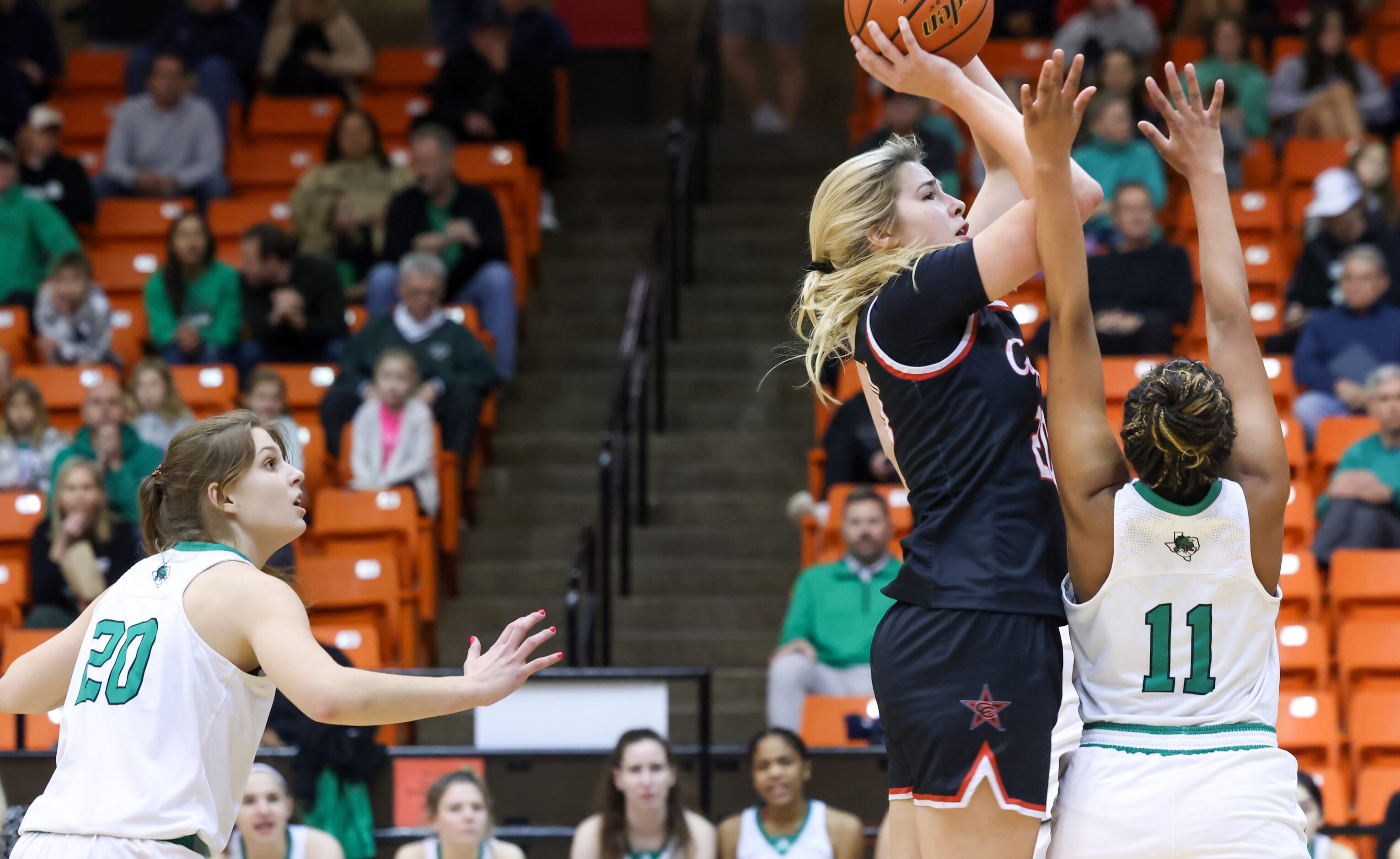 Coppell senior guard Julianna LaMendola (20) moves past Southlake Carroll senior guard...