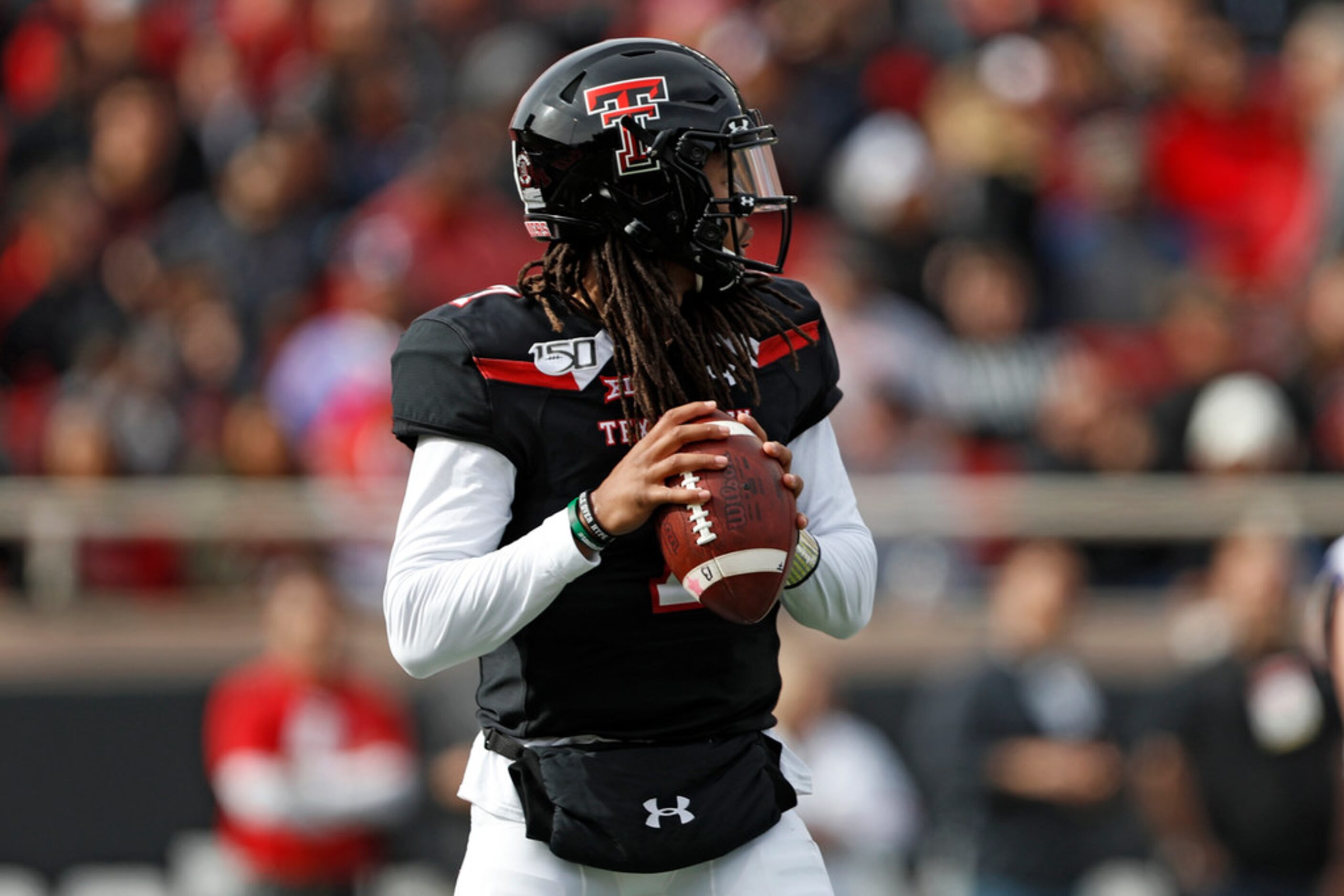 Texas Tech's Jett Duffey (7) looks to pass the ball during the first half of an NCAA college...