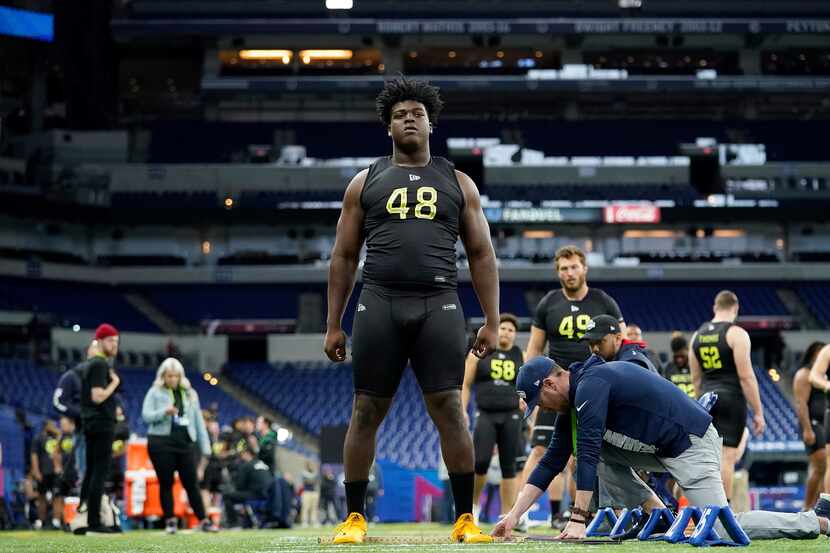 Tulsa offensive lineman Tyler Smith (48) participates in the broad jump at the NFL football...