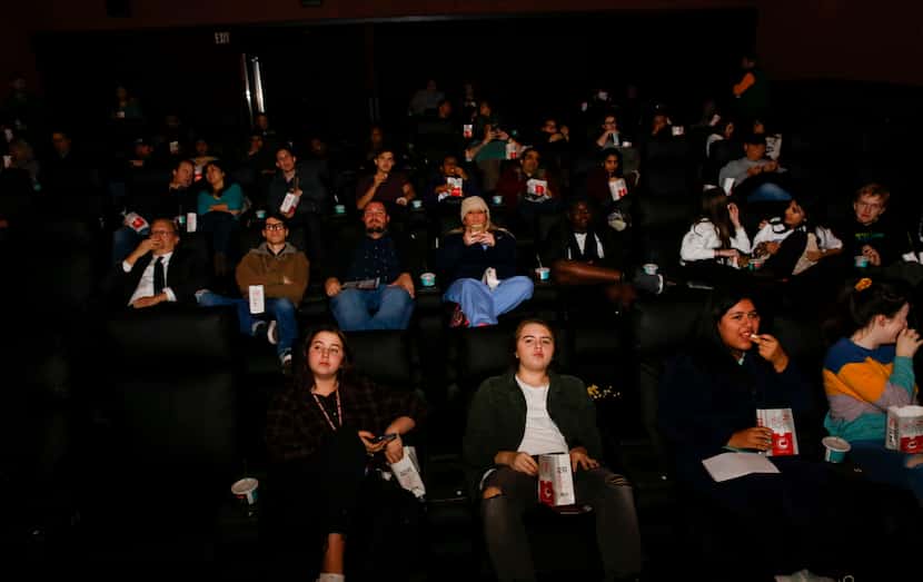 Guests check out the newly remodeled Cinemark theater in Plano. The longtime "dollar...