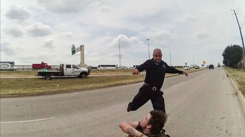 A frame from a police body cam showing  Dallas firefighter Brad Cox during an altercation...