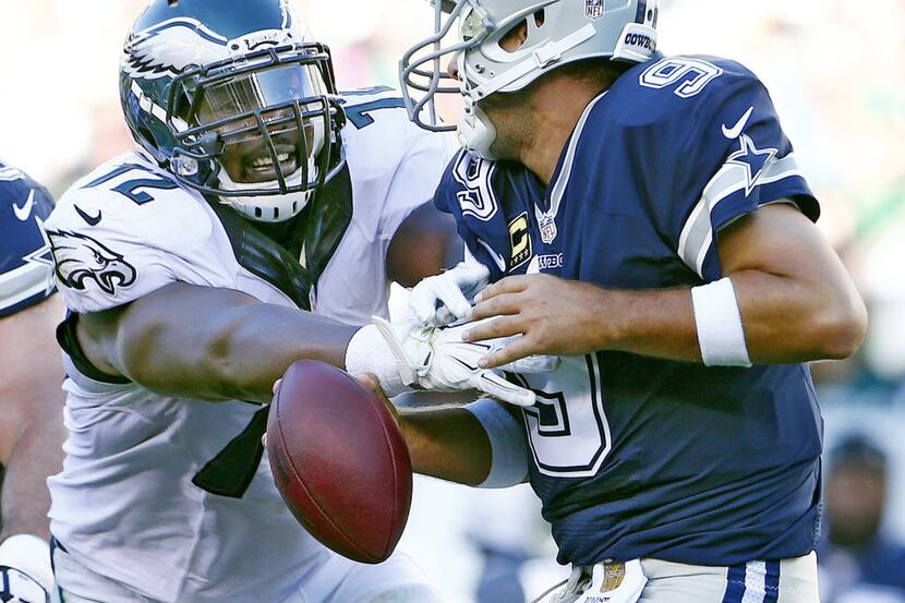 PHILADELPHIA, PA - SEPTEMBER 20: Quarterback Tony Romo #9 of the Dallas Cowboys is sacked by...