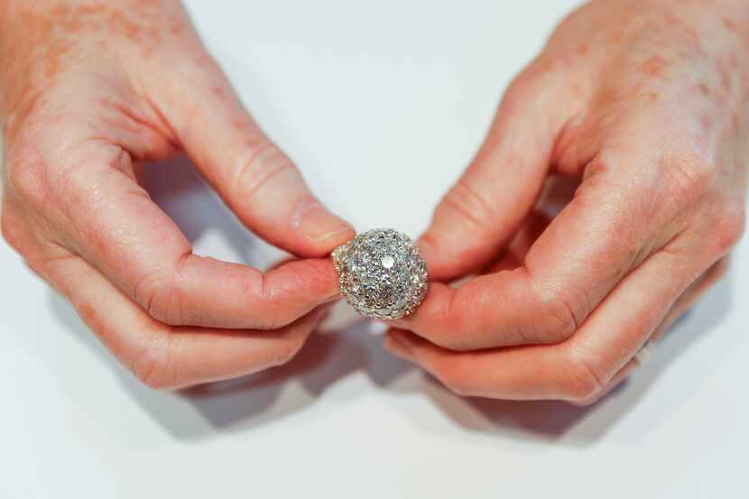 Lawrence Bock, CEO of Bachendorf's holds one of the last rings made by his grandfather and...