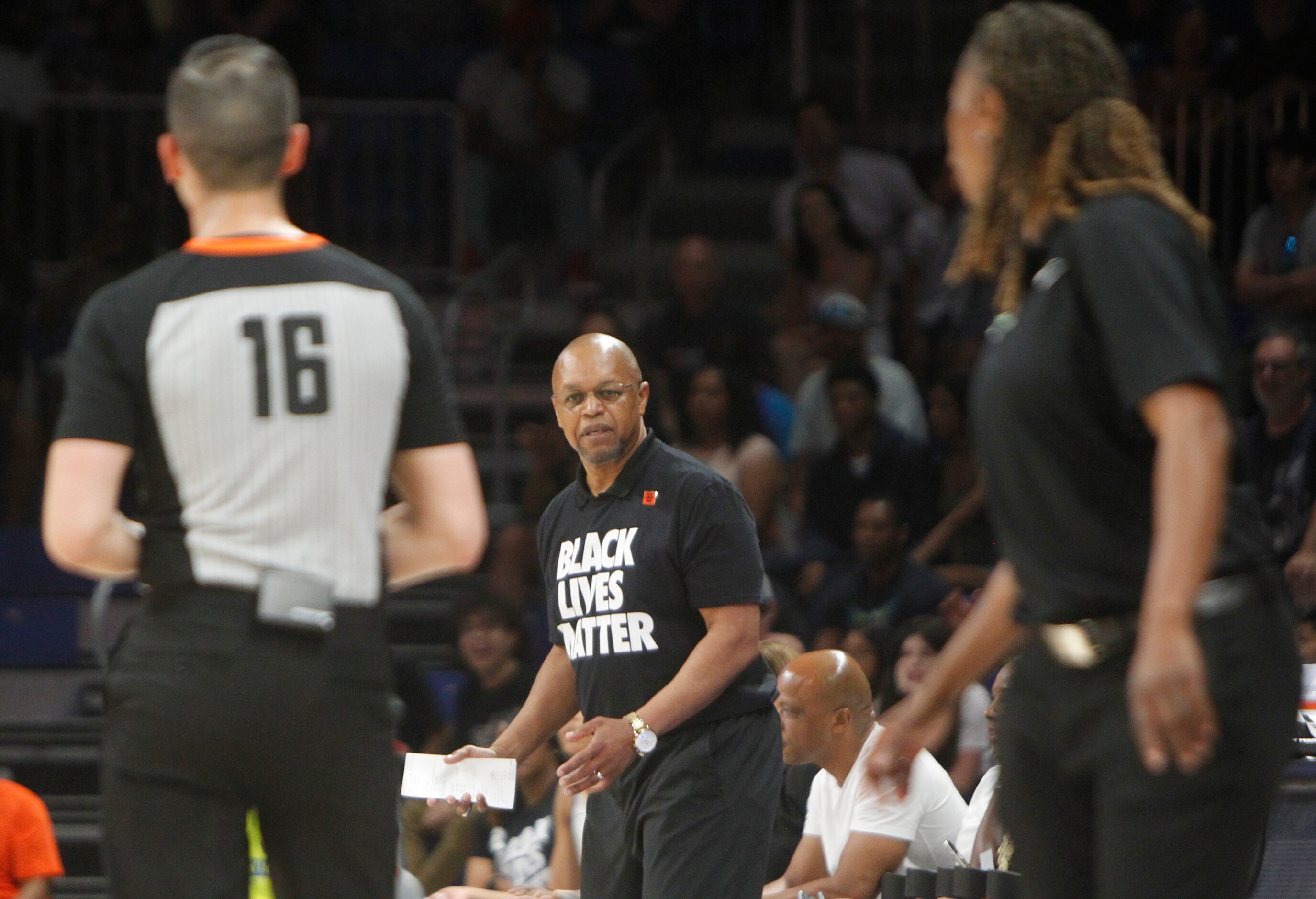 LA Sparks interim head coach Fred Williams questions a referee's call during first half...