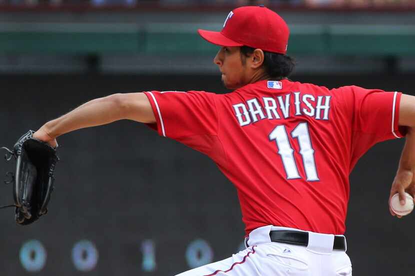 Texas pitcher Yu Darvish throws a pitch during the Los Angeles Angels vs. the Texas Rangers...