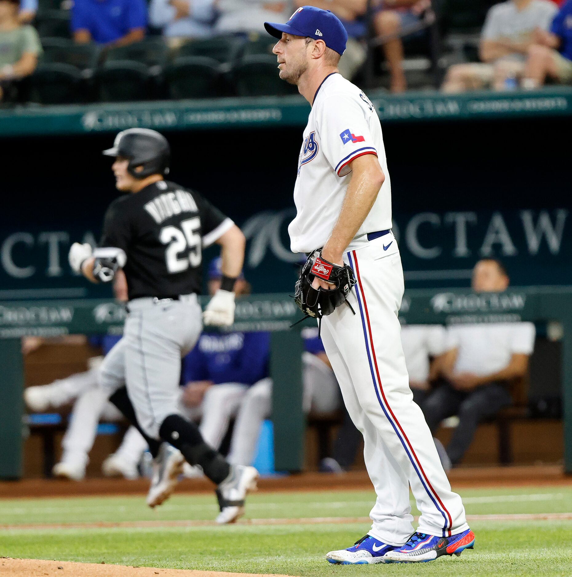 Texas Rangers starting pitcher Max Scherzer (31) reacts after giving up a single to Chicago...