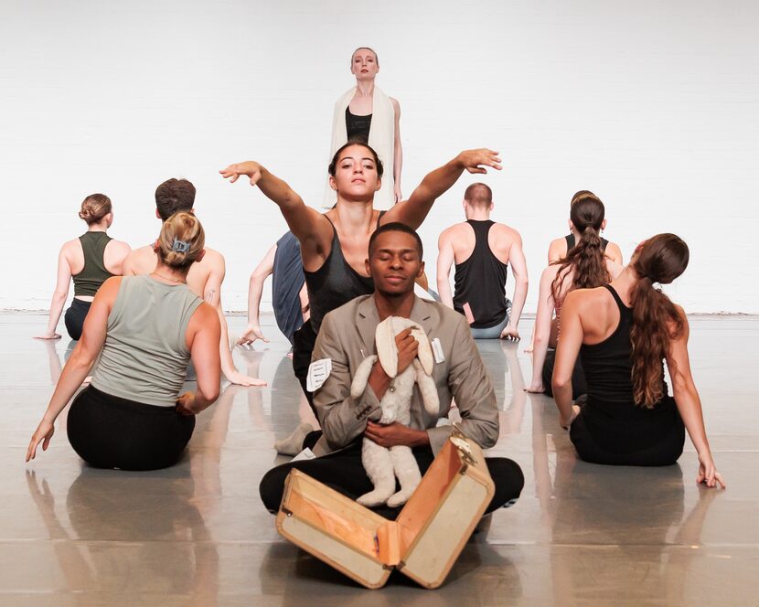 Bruce Wood Dance company member Kevyn Butler, front, portrays an immigrant who misses home...