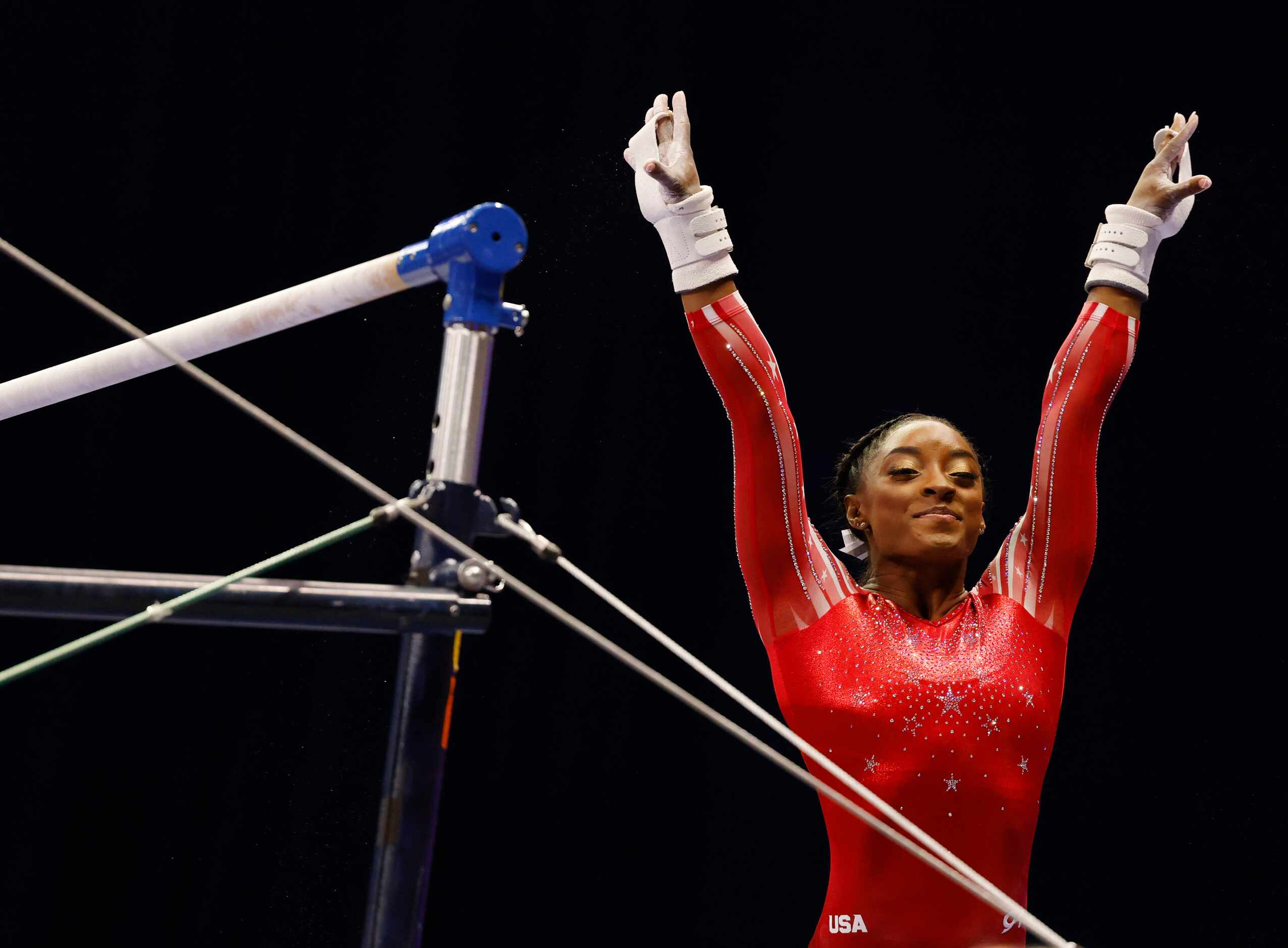 Simone Biles prepares to compete on the uneven bars during day 2 of the women's 2021 U.S....