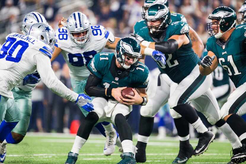 Philadelphia Eagles quarterback Carson Wentz (11) is sacked by Dallas Cowboys defensive end...