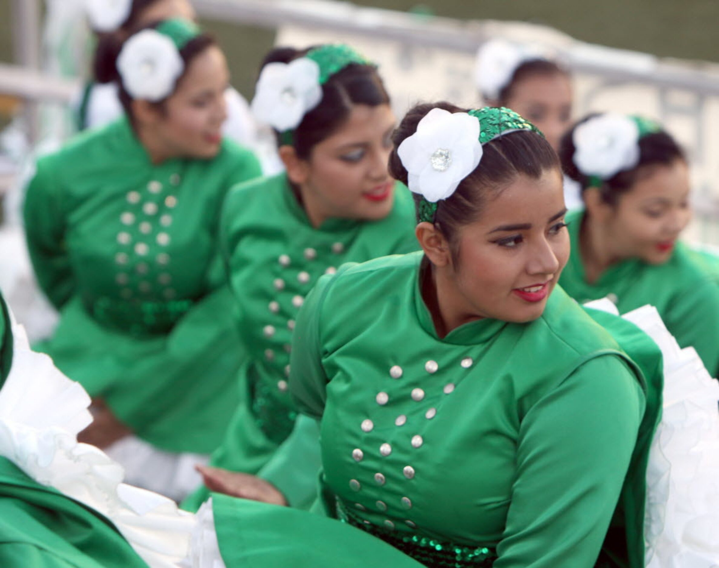 Sara Murtalla, along with other members of the Bryan Adams Belles drill team, warm-up from...