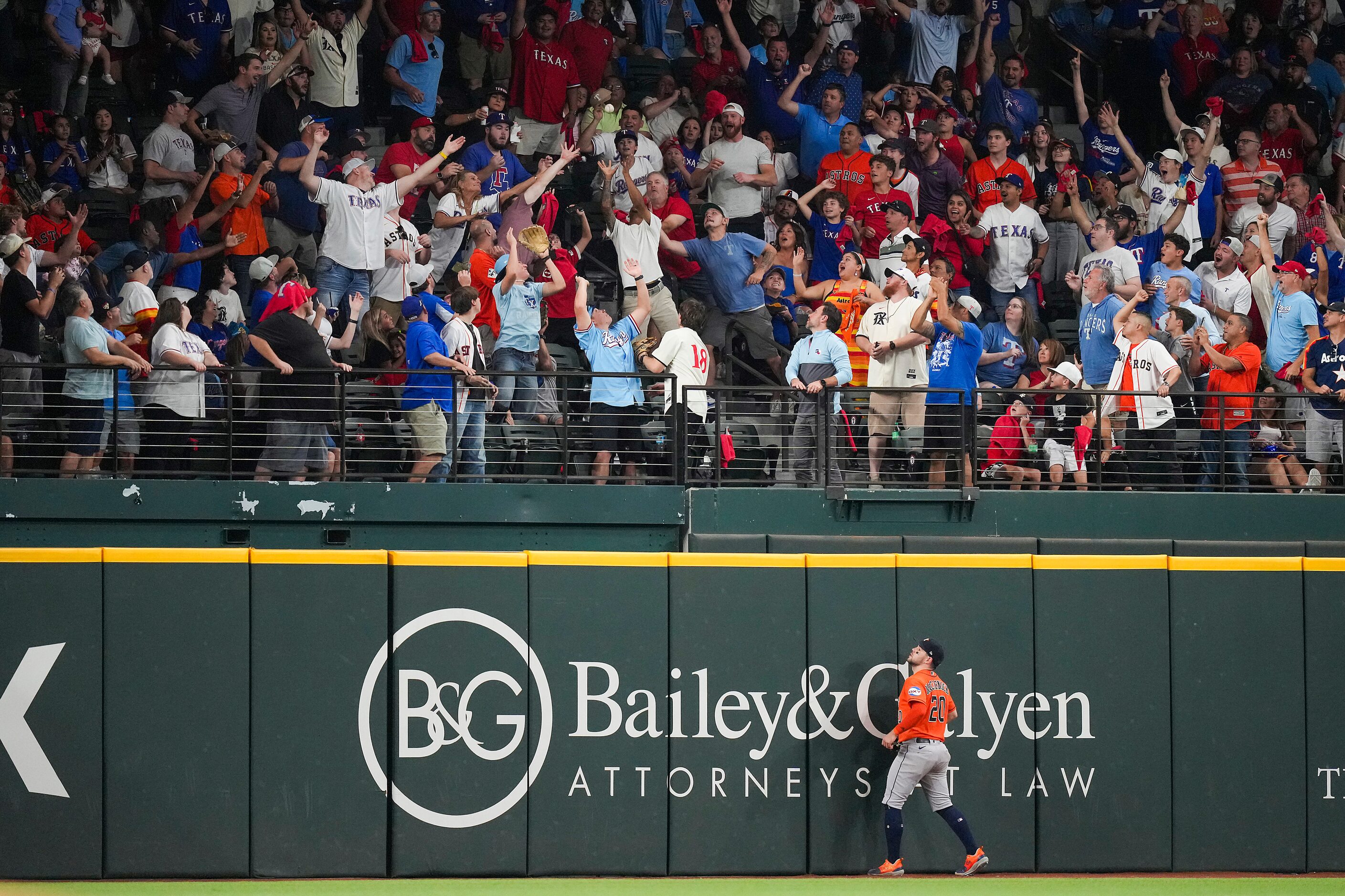 Houston Astros left fielder Chas McCormick watches a home run by Texas Rangers first baseman...