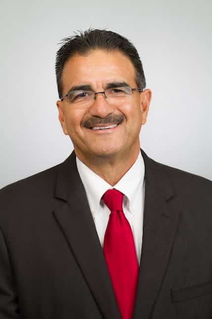 Dallas athletic director Gil Garza