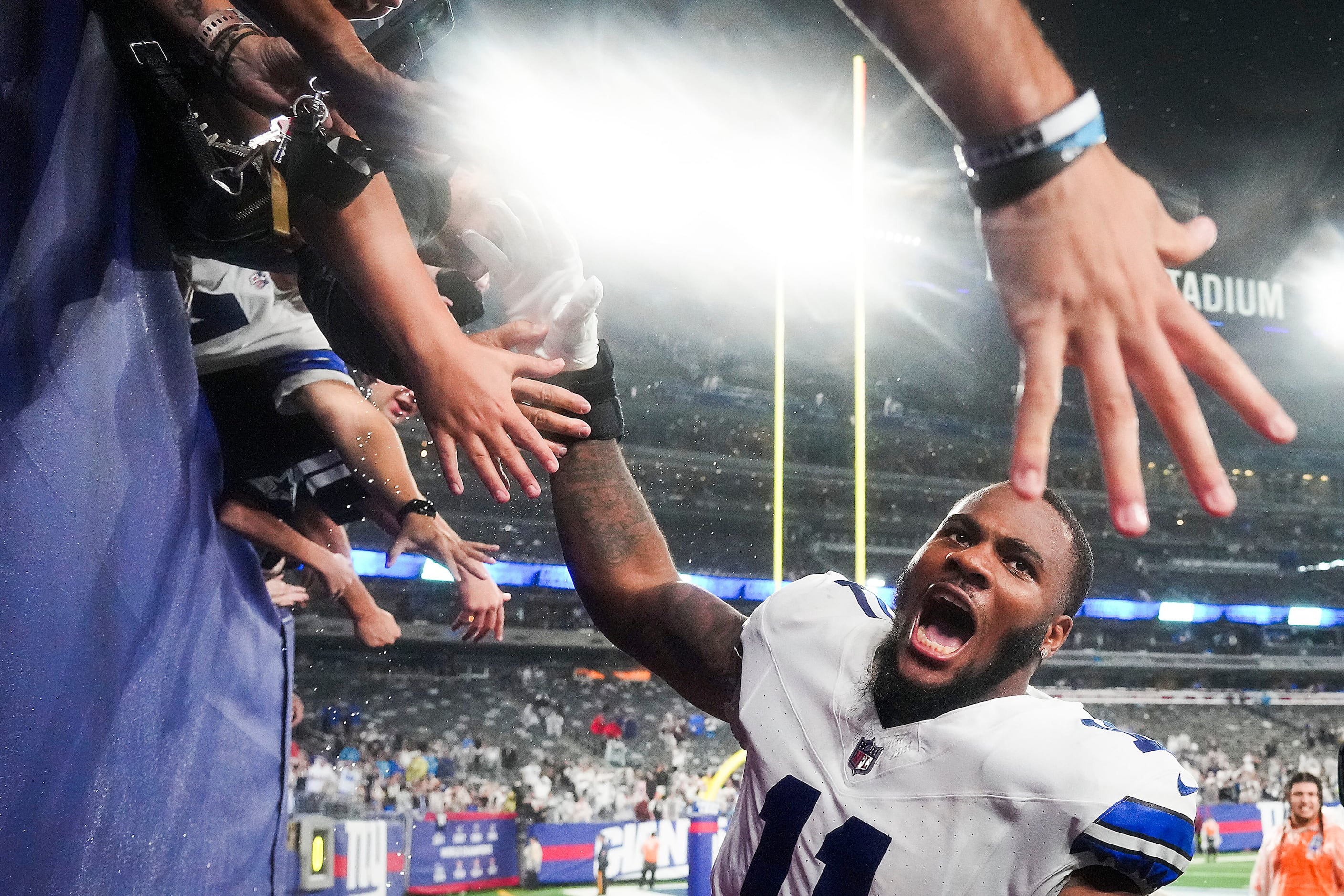 Dallas Cowboys defensive tackle Neville Gallimore (96) celebrates with fans  after an NFL football game against the New York Giants, Sunday, Dec. 19,  2021, in East Rutherford, N.J. The Dallas Cowboys defeated