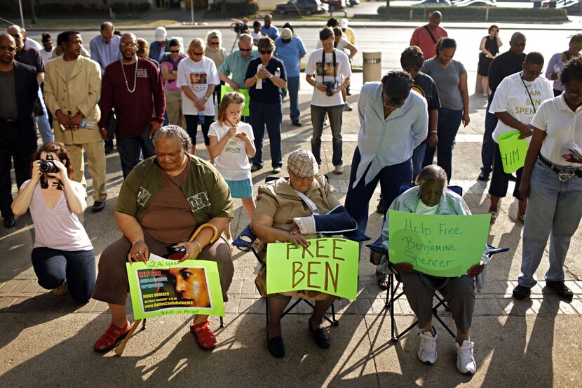 Supporters prayed during a rally for Ben Spencer outside the Frank Crowley Courts Building...