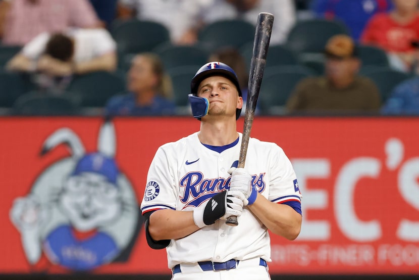 Texas Rangers shortstop Corey Seager (5) reacts after striking out during the eighth inning...