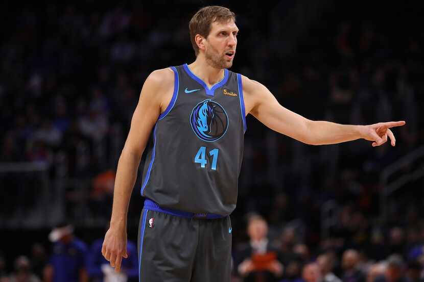 DETROIT, MICHIGAN - JANUARY 31:  Dirk Nowitzki #41 of the Dallas Mavericks looks on while...