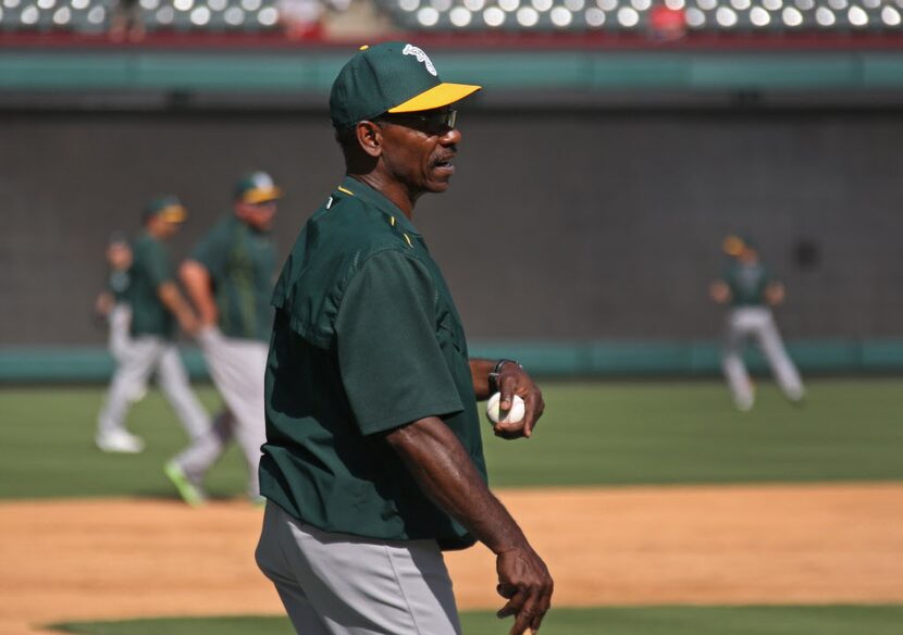 Former Texas Rangers manager Ron Washington works with his new club, the Oakland Athletics,...