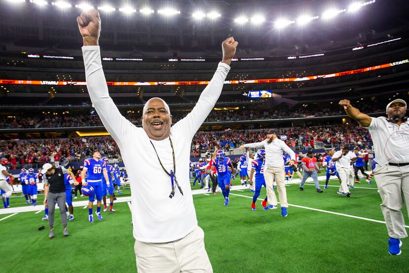 Duncanville head coach ÊReginald Samples leads the celebration as the Panthers bench charges...