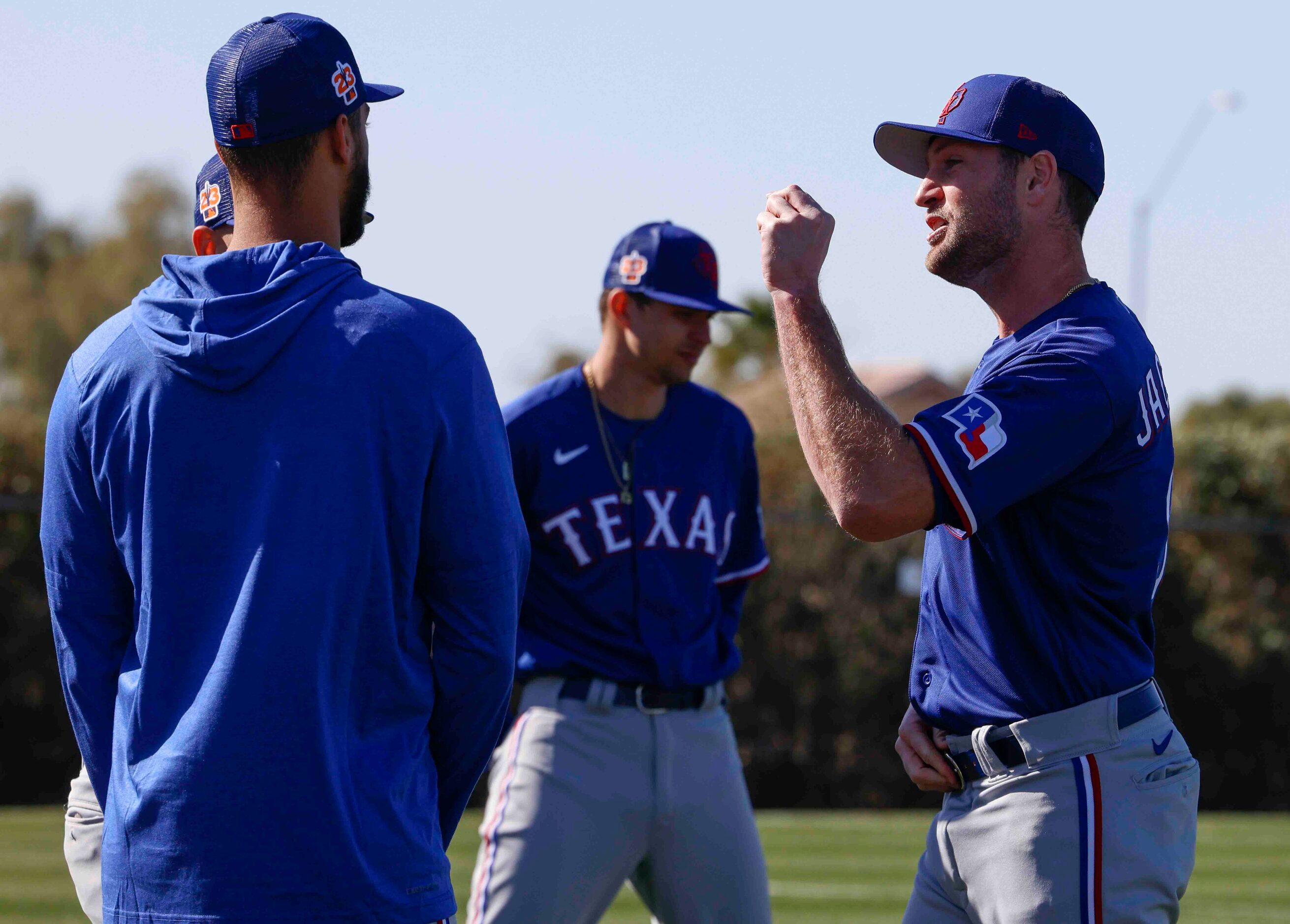 Texas Rangers left handed pitcher Lucas Jacobsen, right, interacts with his teammates during...