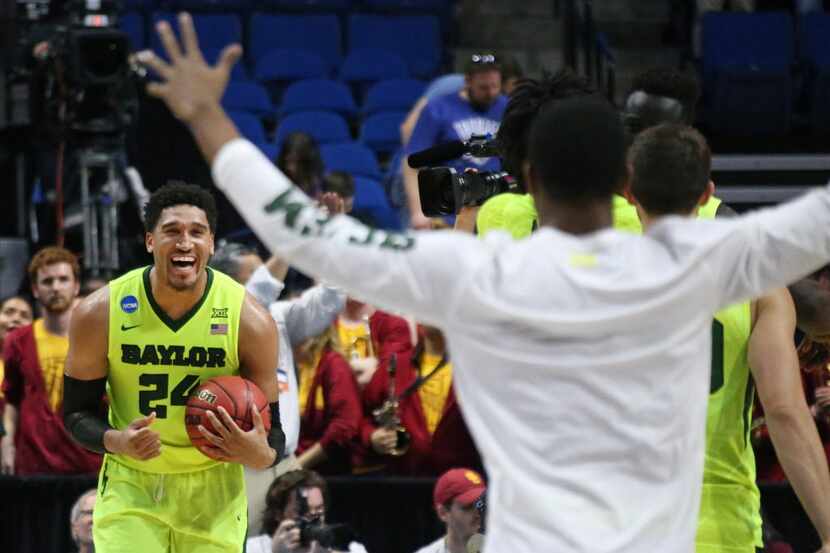 Baylor Bears guard Ishmail Wainright (24) celebrates with teammates as time winds down in...