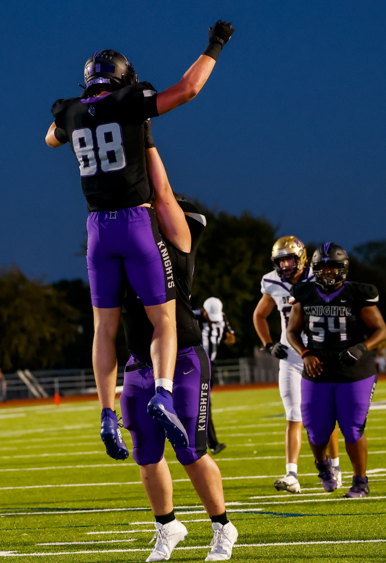 Frisco Independence’s tight end Jake Simpson (88) celebrates his touchdown with teammates...