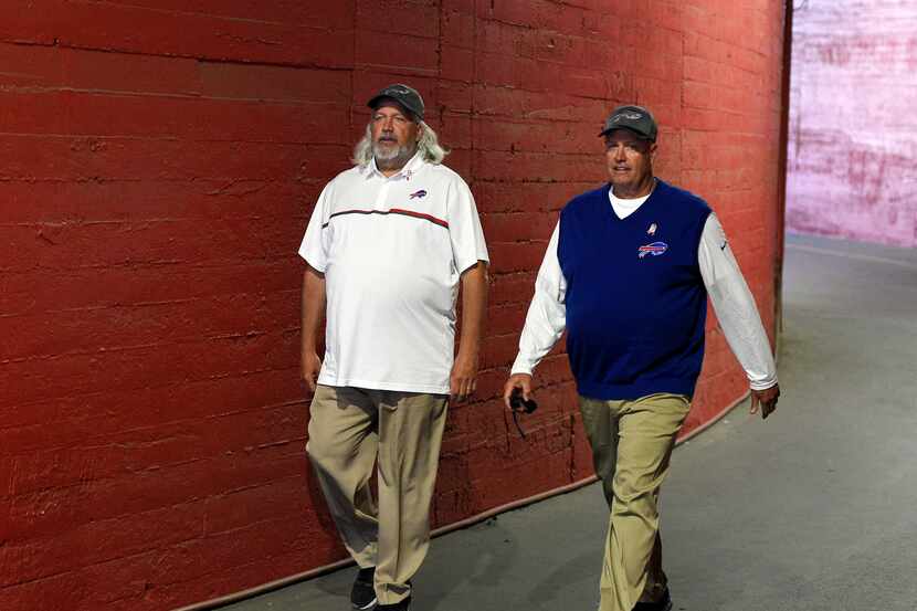 Buffalo Bills head coach Rex Ryan walks with assistant head coach Rob Ryan, left, prior to...