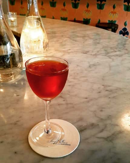 A Smoky Negroni subs mezcal for gin at Angel Face, a wisp of a spot with an elegant...