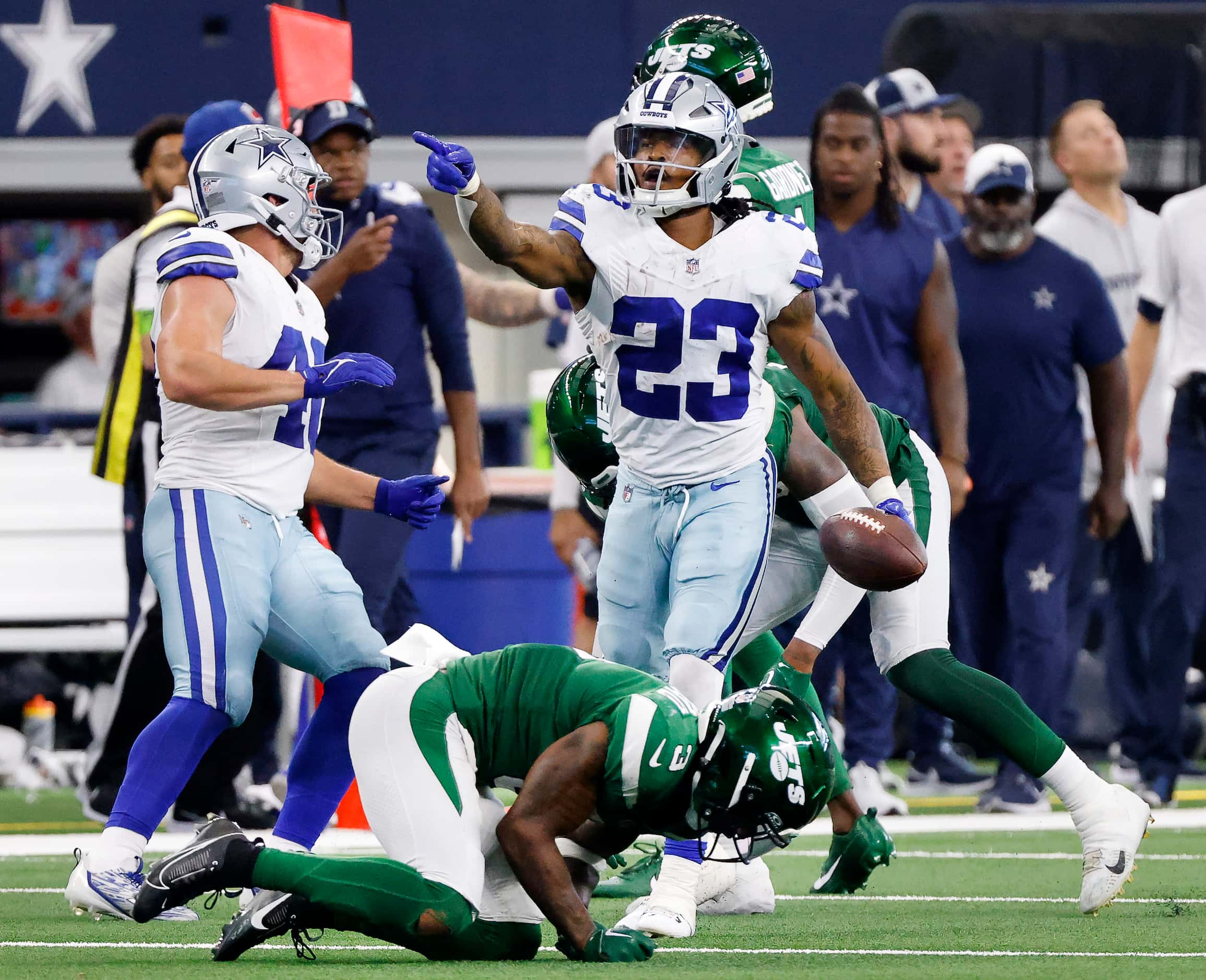 Dallas Cowboys running back Rico Dowdle (23) signals first down after running against the...