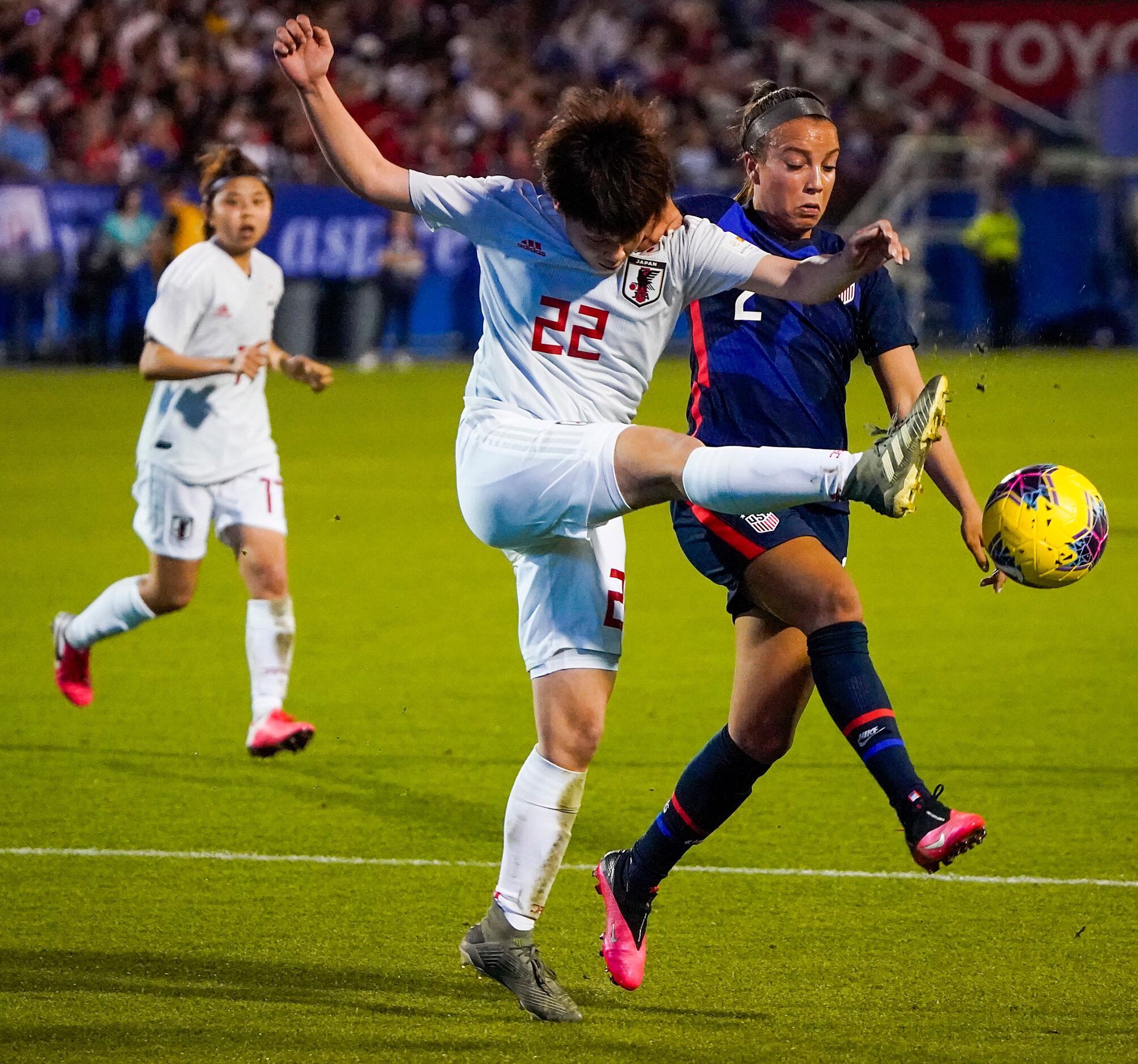 USA forward Mallory Pugh (2) fights for the ball against Japan defender Mayo Doko (22)...