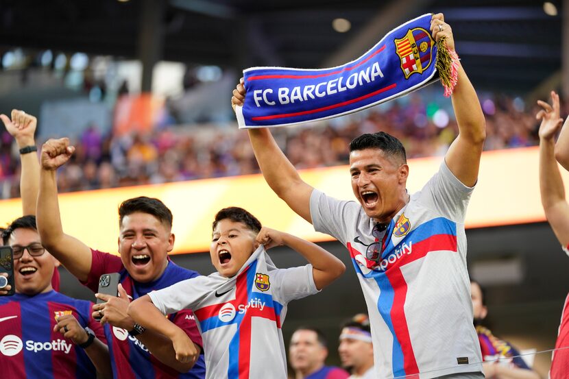 Fans cheer before Wednesday's soccer match between FC Barcelona and Arsenal FC in Inglewood,...